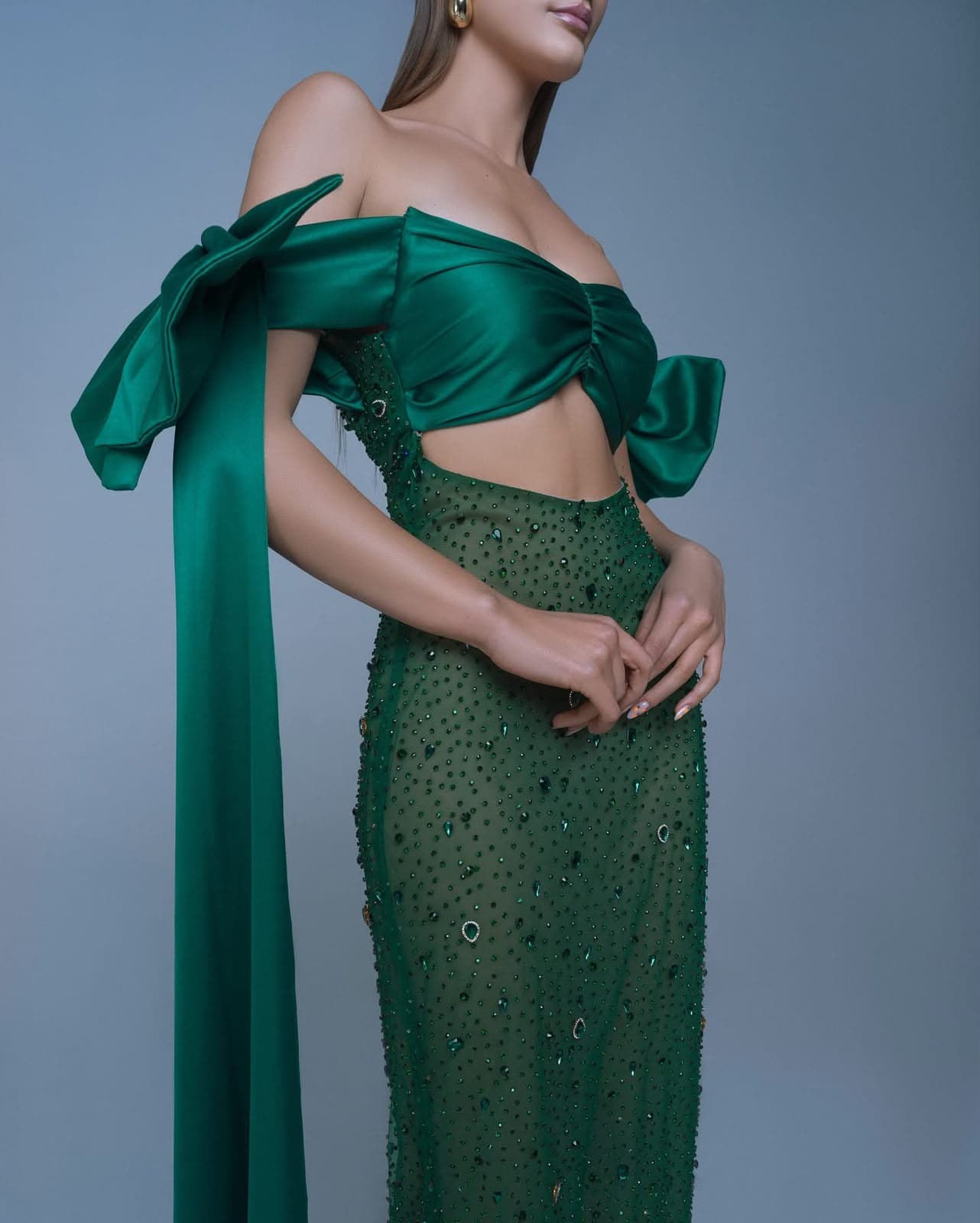 Beaded bodice and satin bow detail on the model