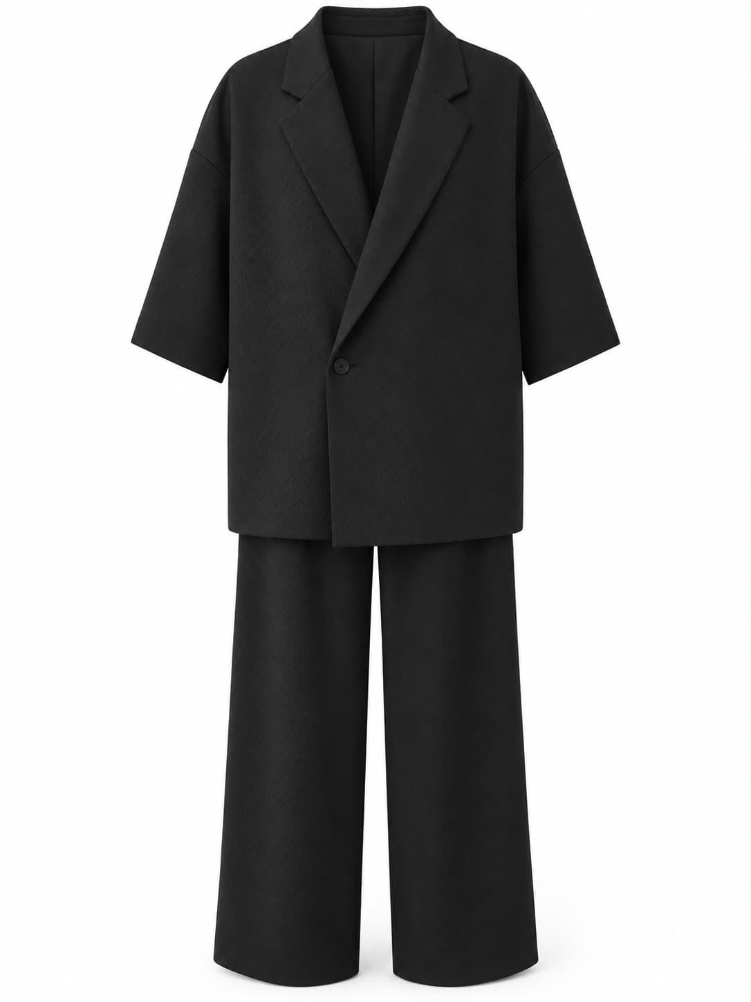 Black oversized suit, jacket and trousers laid flat, front view