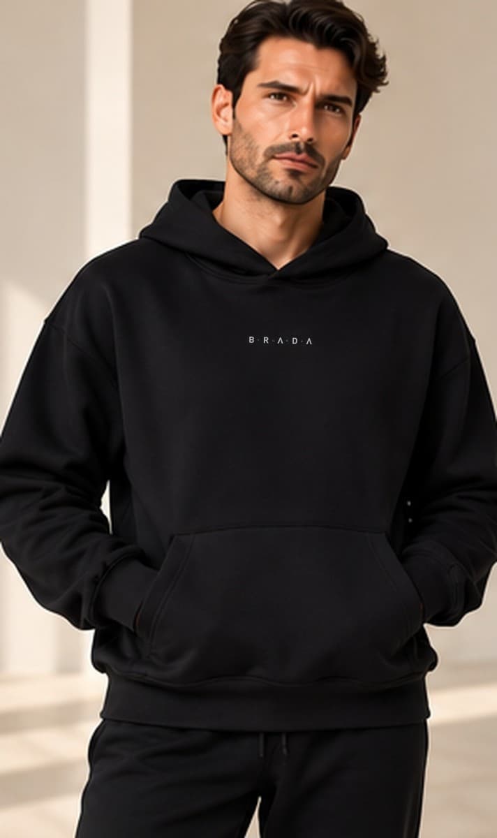 Brada Man Hoodie worn with matching black joggers, front view
