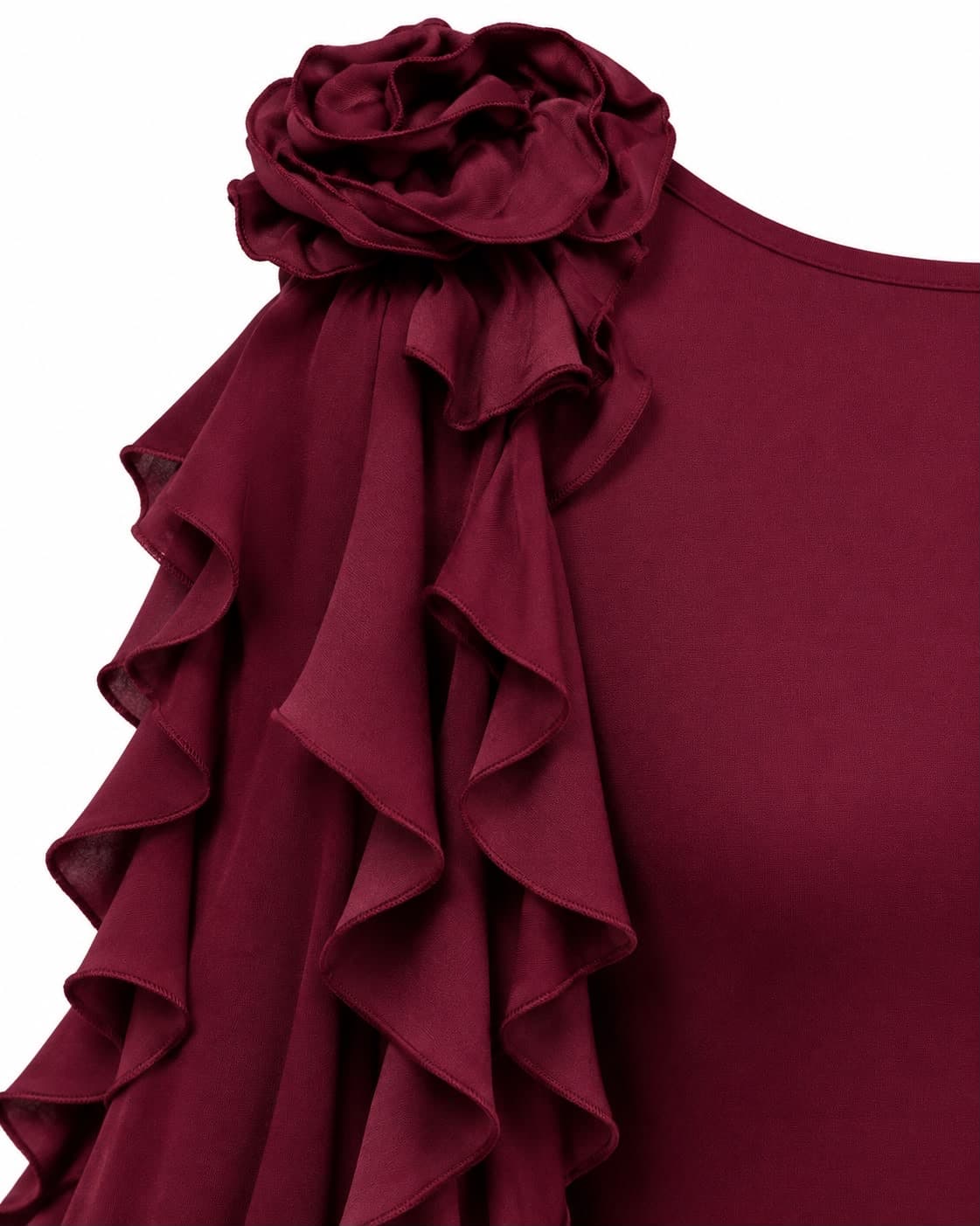 Close-up of the fabric rosette and ruffle trim at the shoulder of the bordeaux gown
