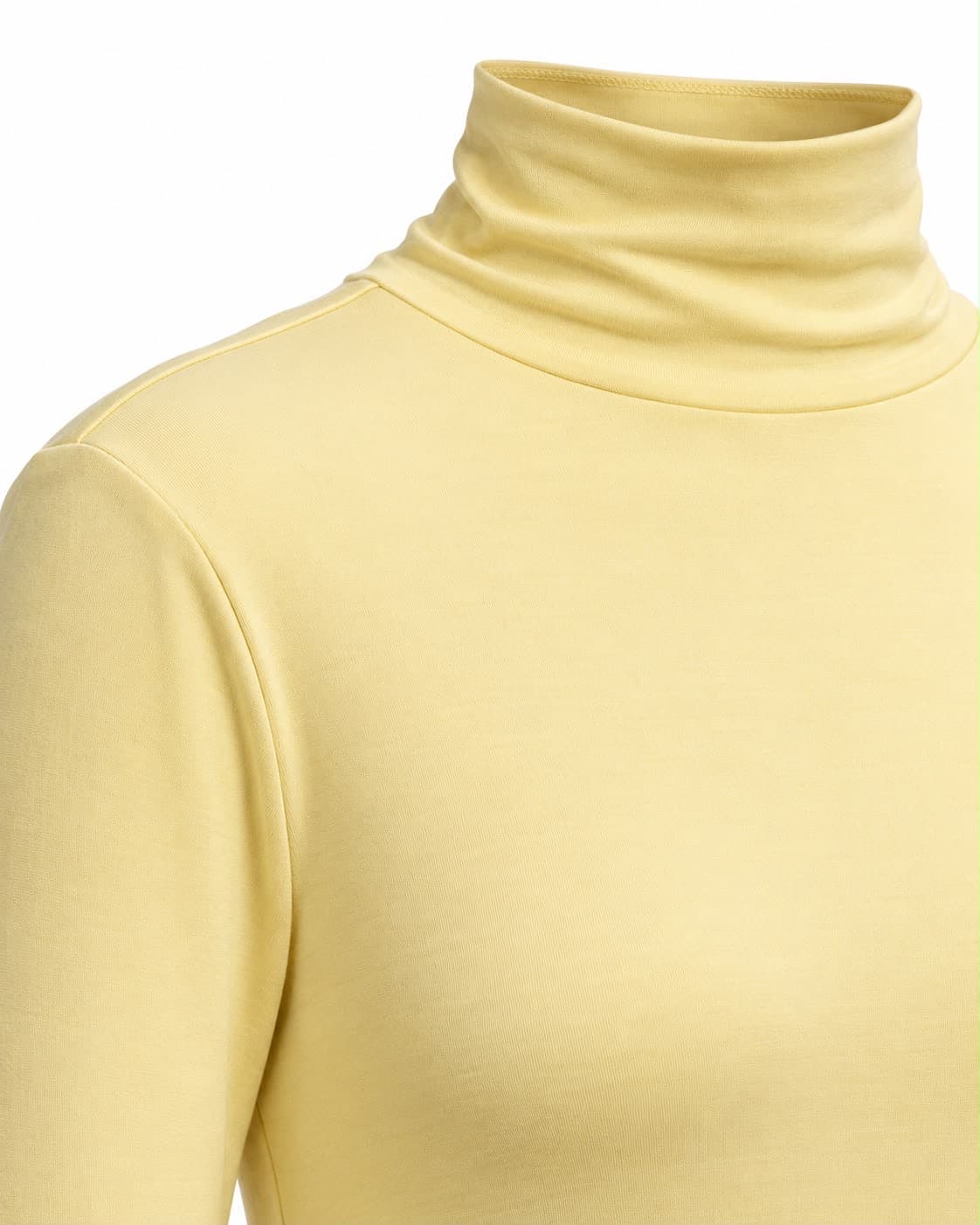 Close-up of the turtleneck and shoulder of the pale yellow jersey gown